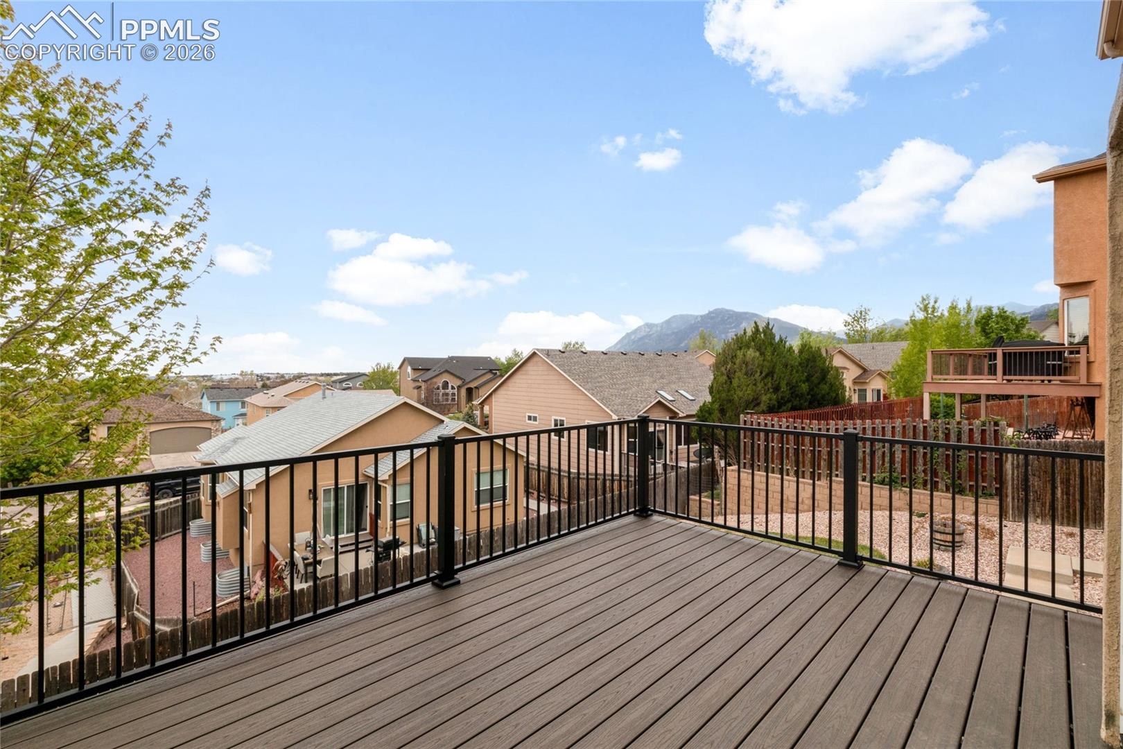 Updated composite decking with views of Cheyenne Mountain.