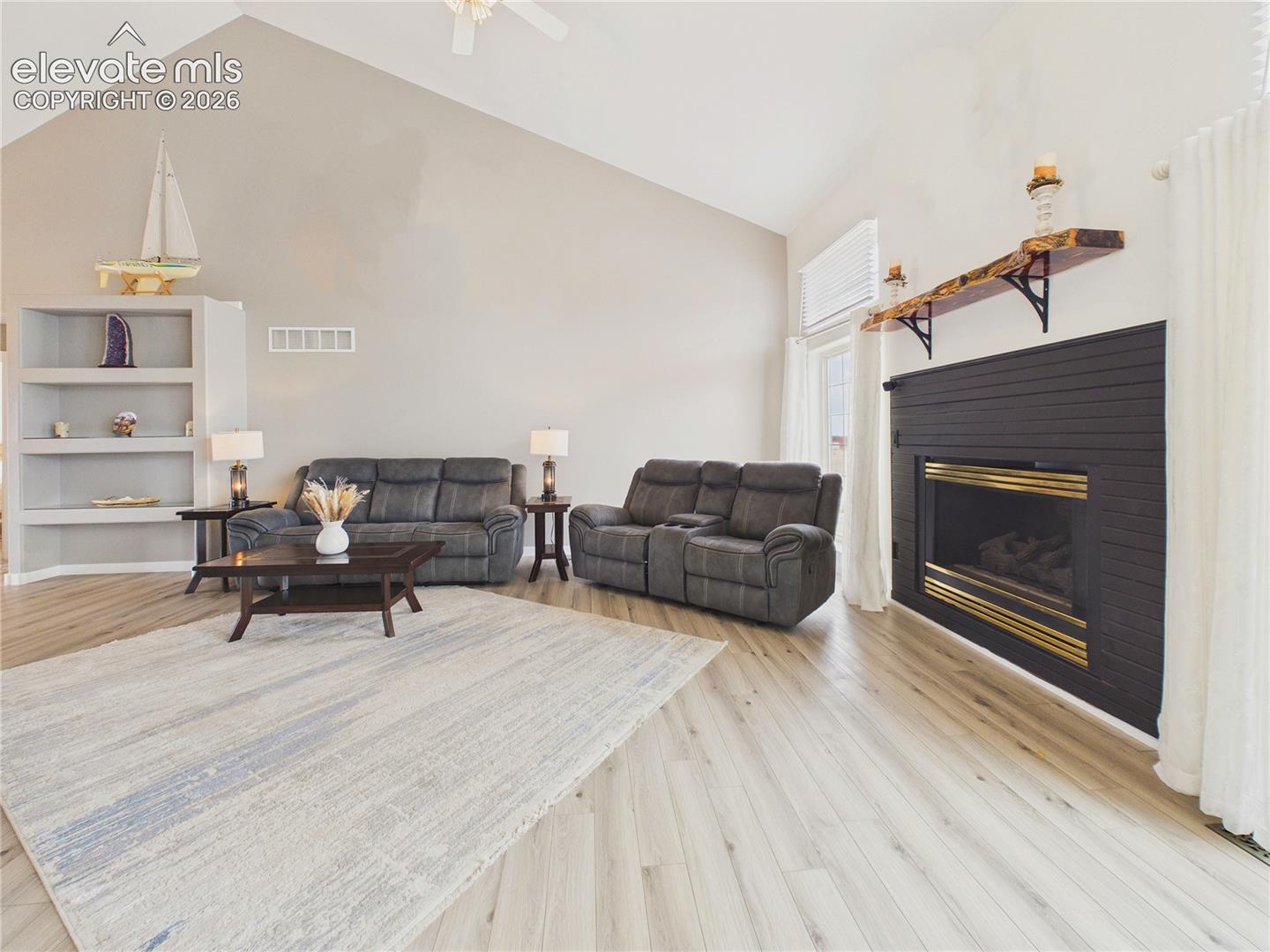 The expansive living room offers plenty of space for relaxing or entertaining, complemented by updated flooring and contemporary finishes.
