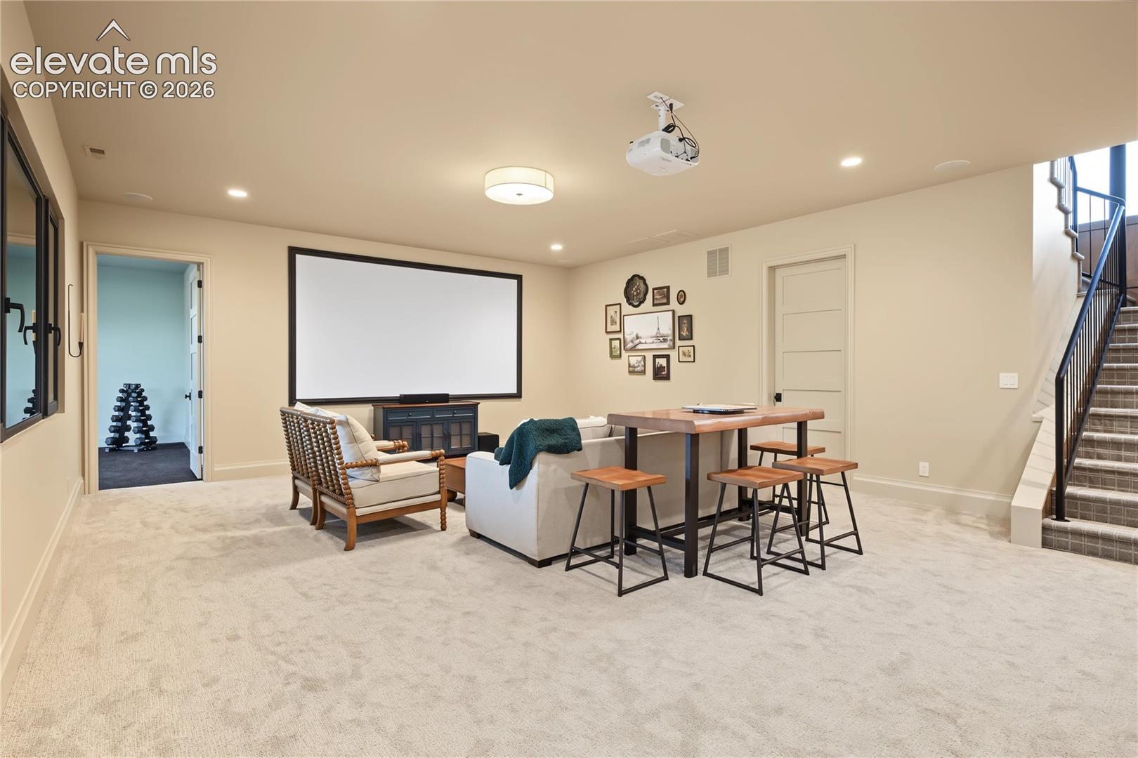 Enjoy watching your favorite show or movie on this 11' projected screen, basement