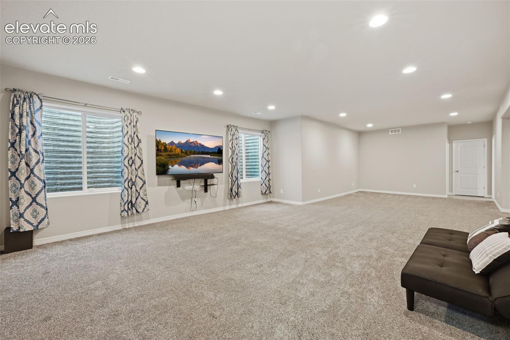 Expansive 35' × 18' Finished Recreation Room — Space for Theater, Games, Fitness & More
