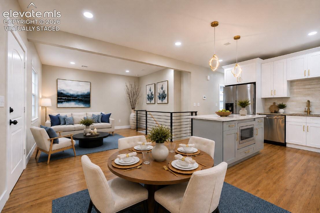 Same view, but virtually staged. The living room furniture layout shows the room can be arranged flexibly, offering a different perspective from the first staged photo of this room.
