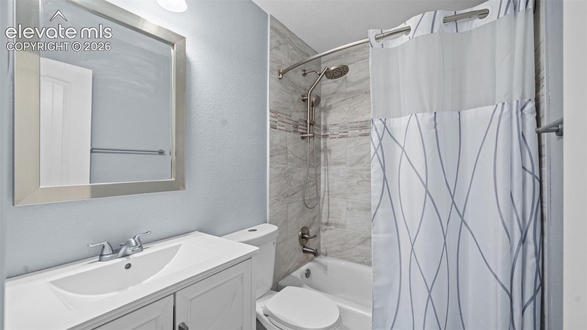 Bathroom vanity with integrated sink and brushed nickel faucet