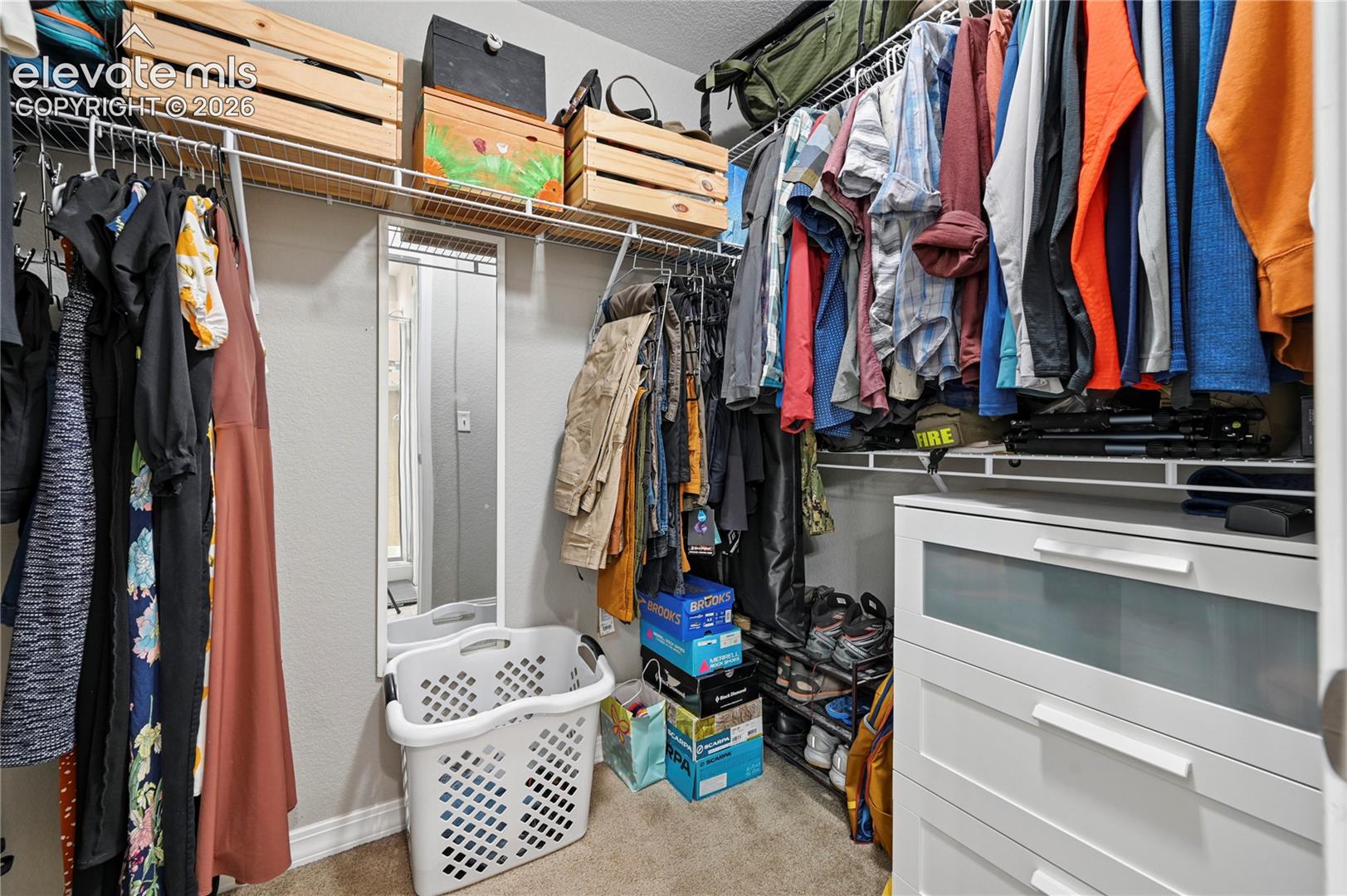 The walk-in closet for the primary suite extends behind the door to the left, and gives you the space you wanted for fashion, storage, sneakers, uniforms, or outdoor gear.