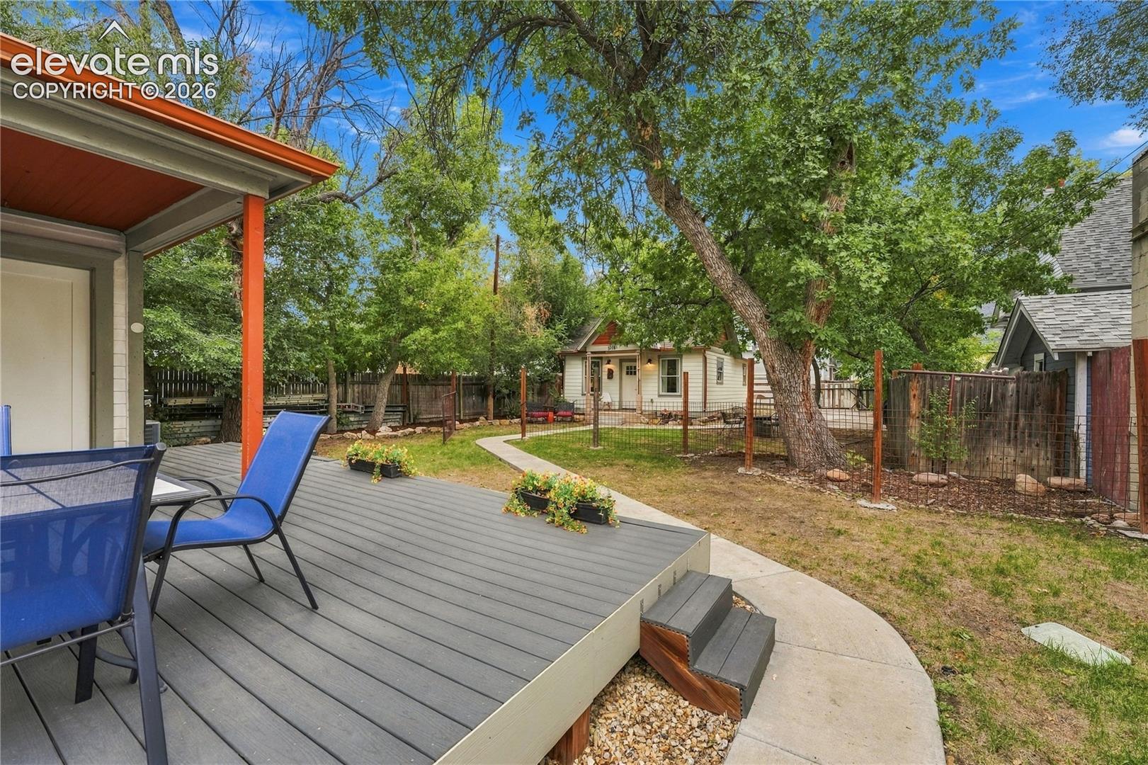 View from deck into the backyard separated into 2 yards, 