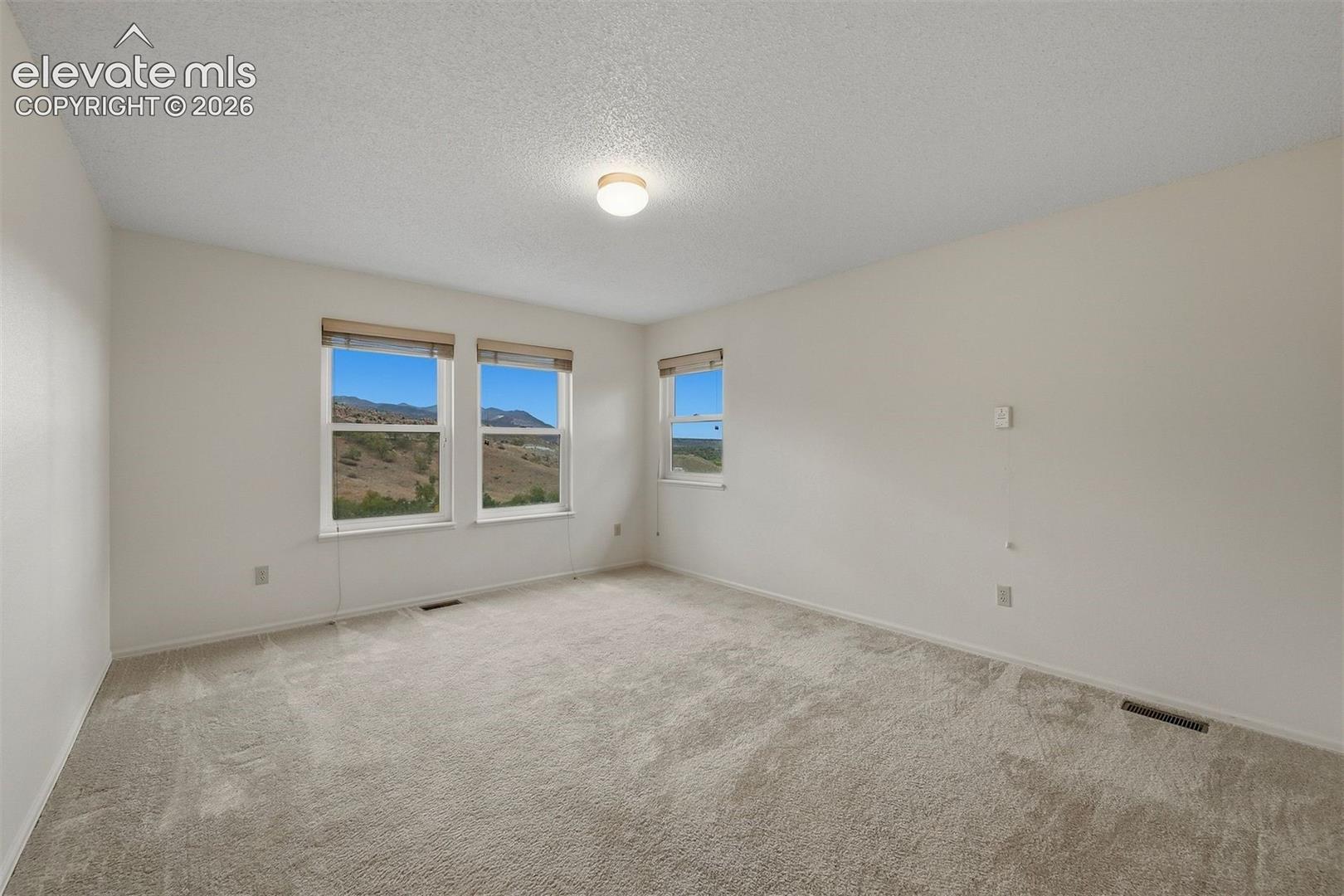 2nd bedroom on back of home with Garden of the Gods views