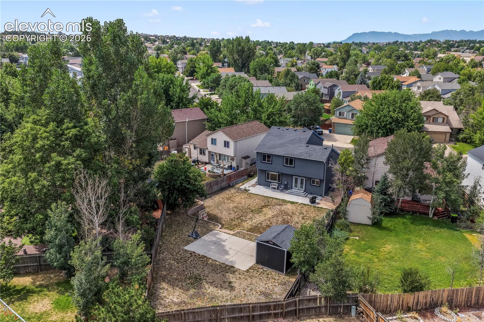 Aerial view of backyard on large lot