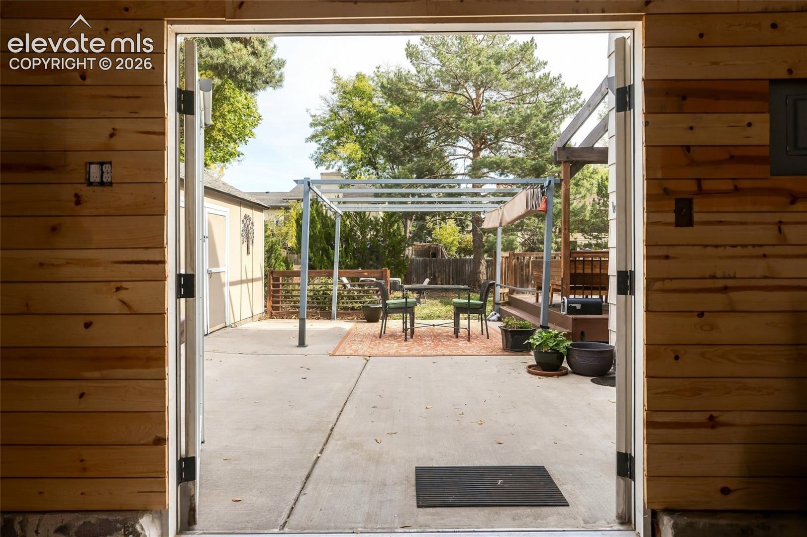 View looking into back courtyard from garage.