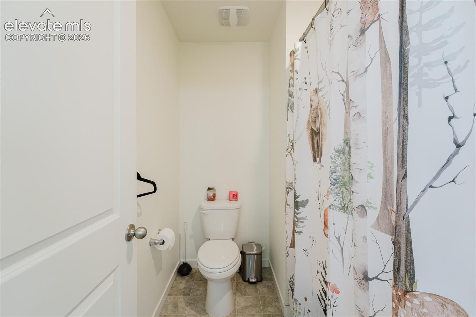 Toilet Room and tub/shower in upper level Hall Bathroom.