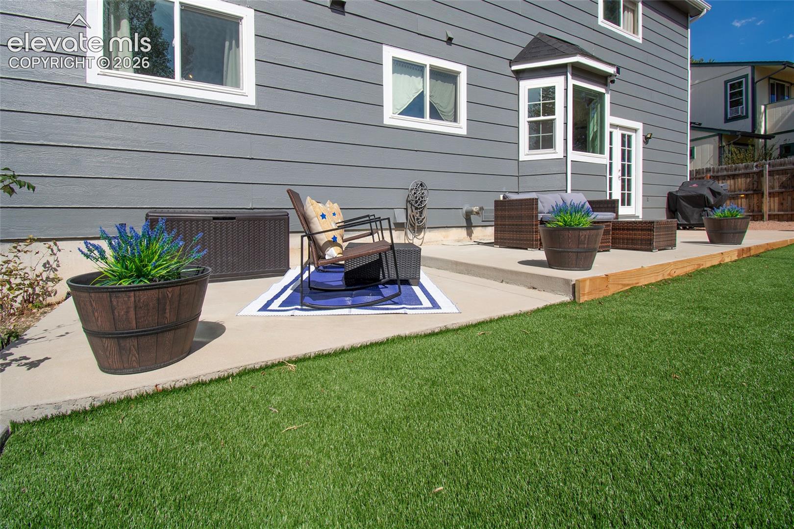 Expansive 43 X 10 concrete back patio perfect for multiple seating areas, relaxing, grilling and entertaining!