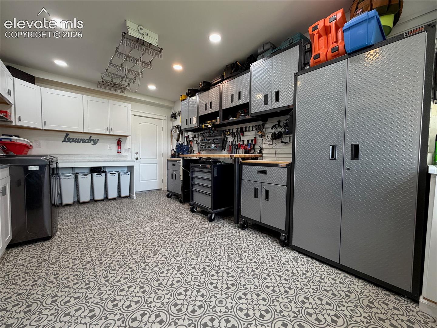 In addition to laundry this room was also a tool room.  Cabinets and tools did not stay.