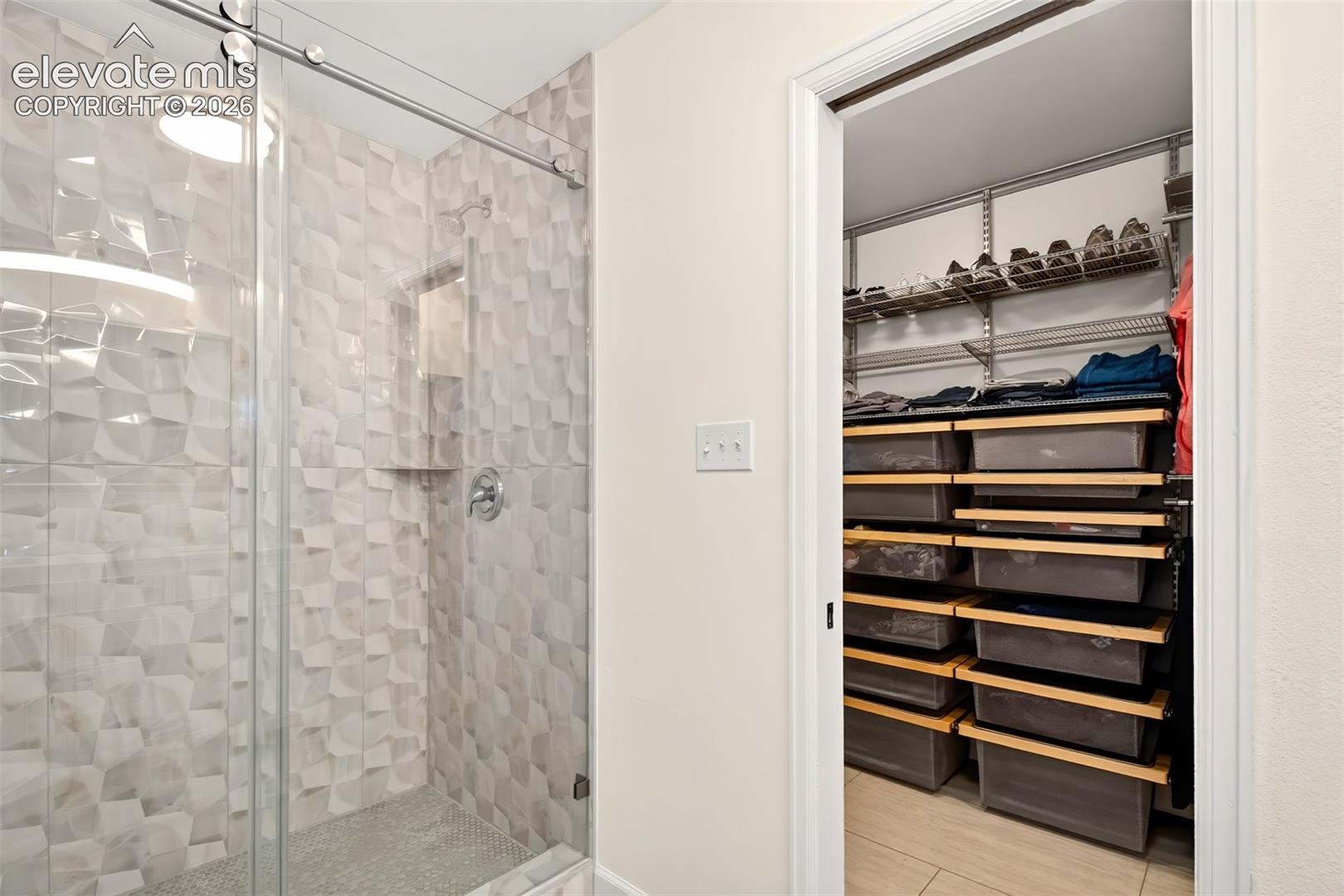 A large luxurious shower in the primary bathroom
