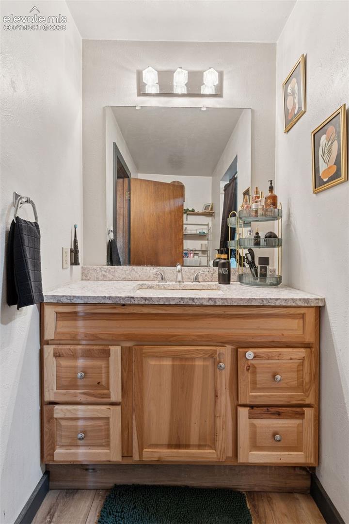 Full bathroom with updated vanity and fixtures; includes a tub/shower combination similar to other home (not pictured)