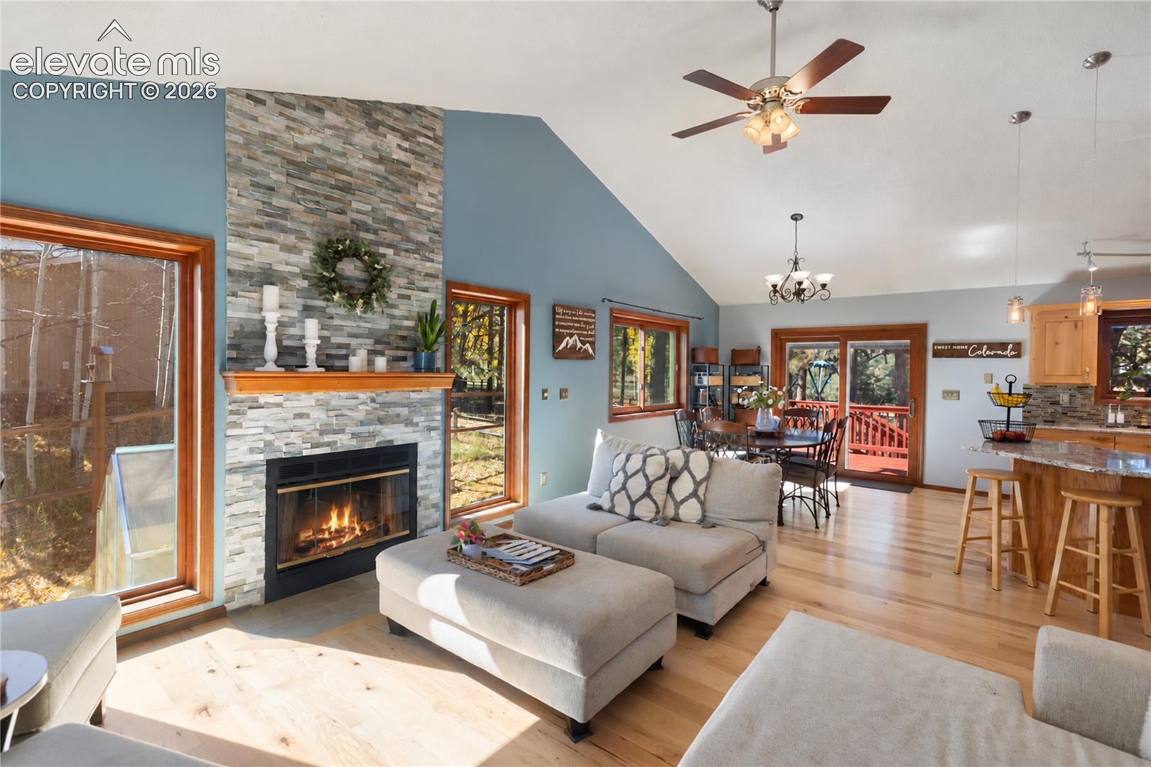 With a beautiful gas, stacked stone fireplace