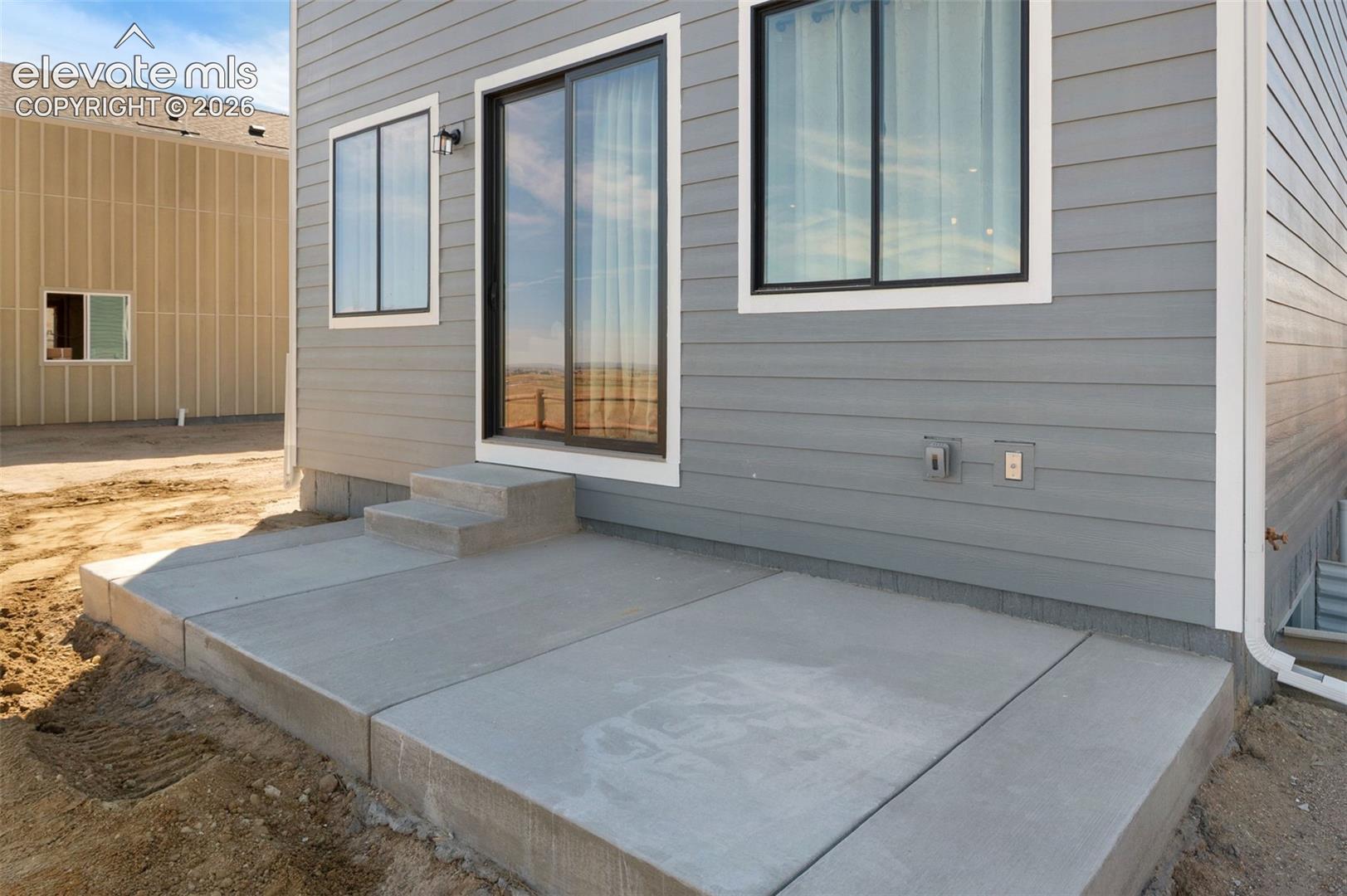 Concrete patio with stepped entry