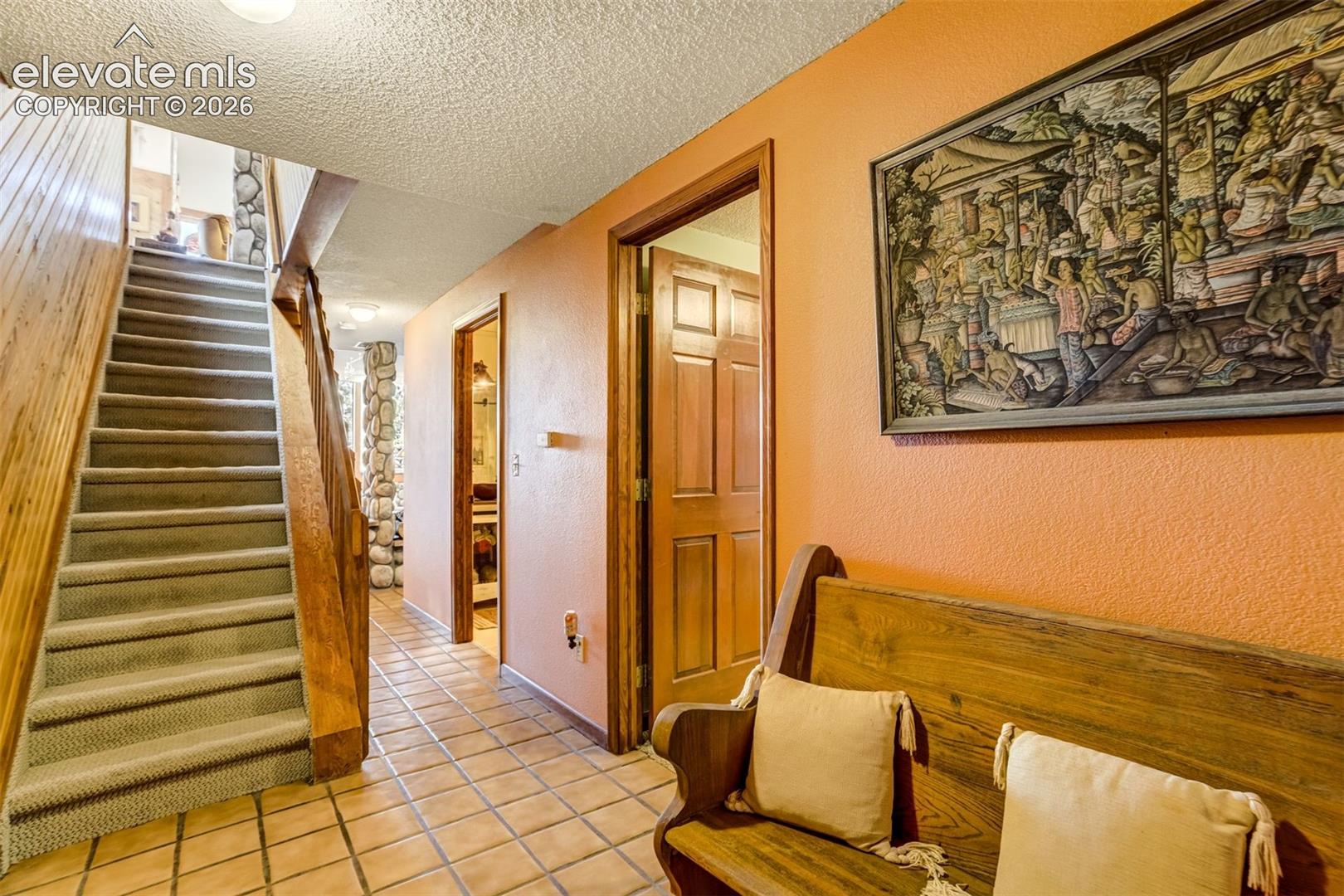 Entrance to the basement that walks into the 3 car garage as well as out to the rear of the home where the views are