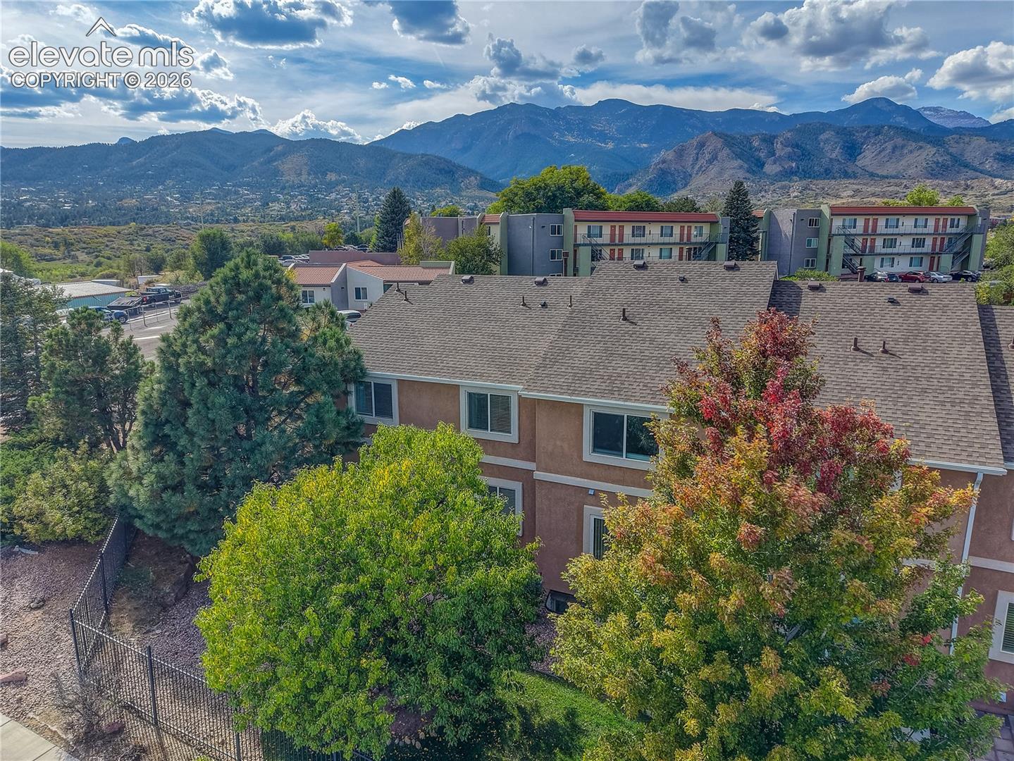 Aerial view of townhome with mountain views.