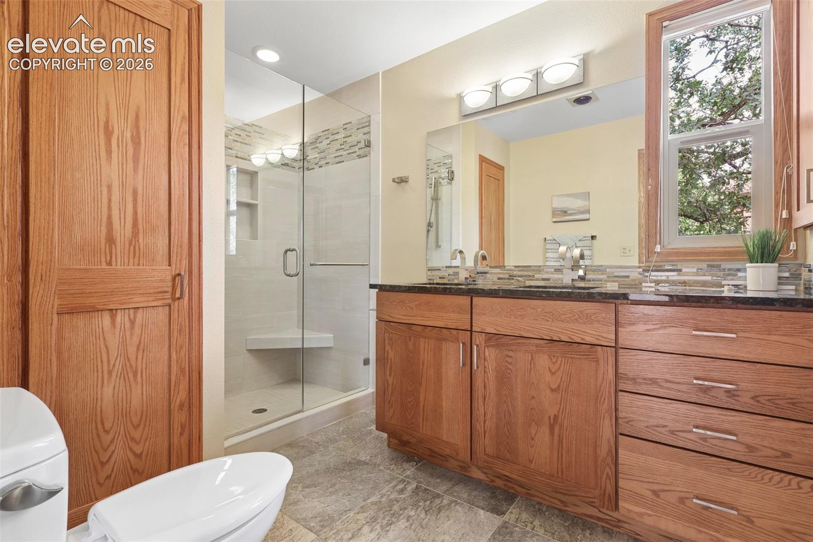 Enjoy the linen storage and spacious shower!
