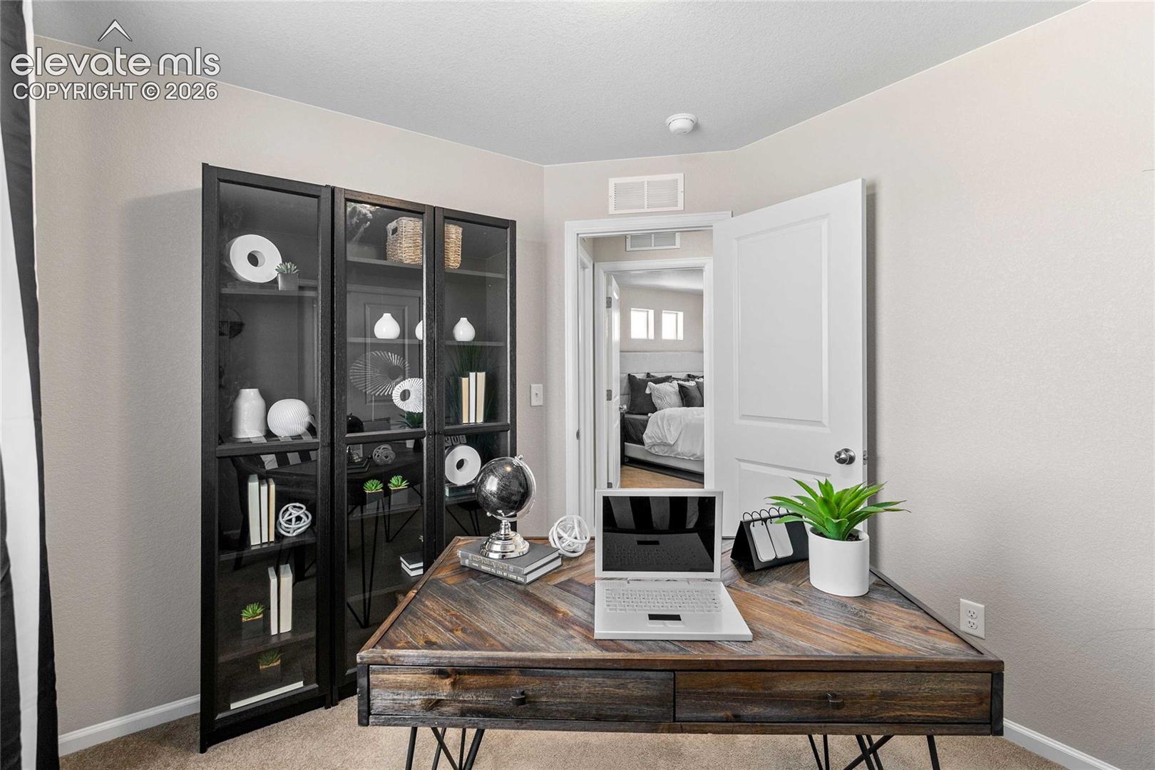 Neutral-toned walls complement the carpeted flooring
*photos of a model home*