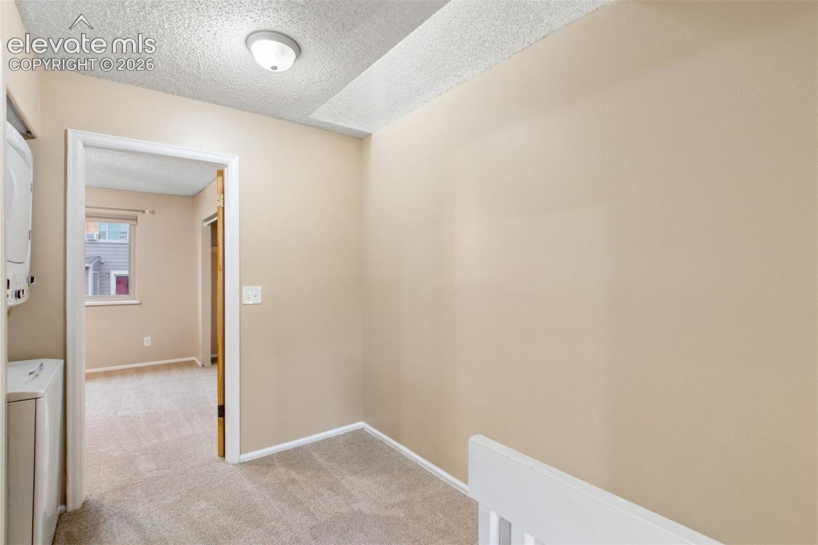 The upper level has a Laundry Area, Primary Bedroom, and a Secondary Bedroom that can be utilized as a bedroom, hobby room, workout room, home office, and more!