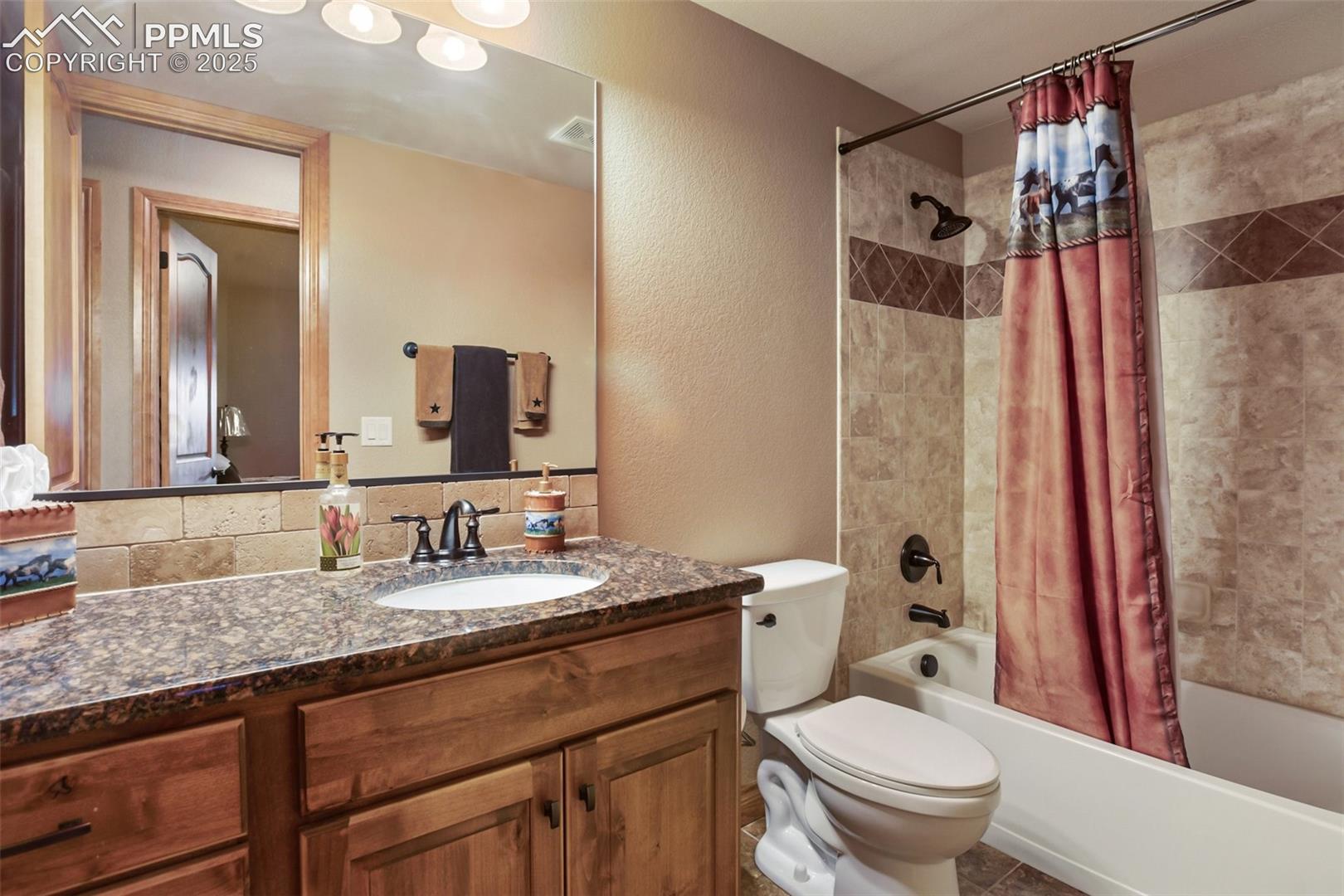 Full bathroom in lower level located across from bedroom
