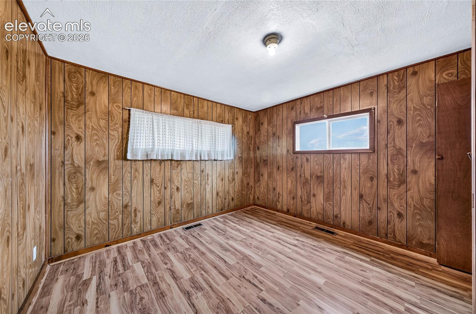 Primary bedroom with walk-through closet