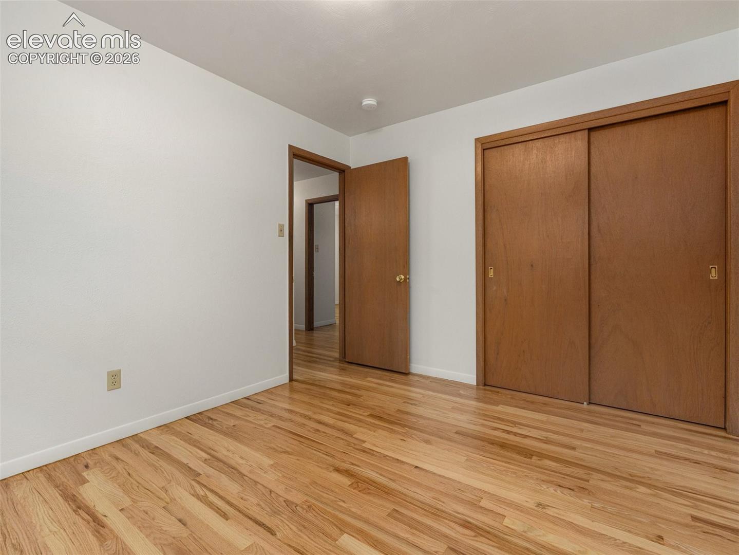 Hardwood flooring throughout, with a neutral wall finish