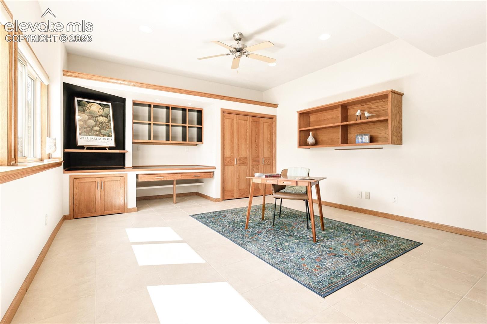 The large private office/studio boasts a wall of windows providing natural light!  The room is at garden level.