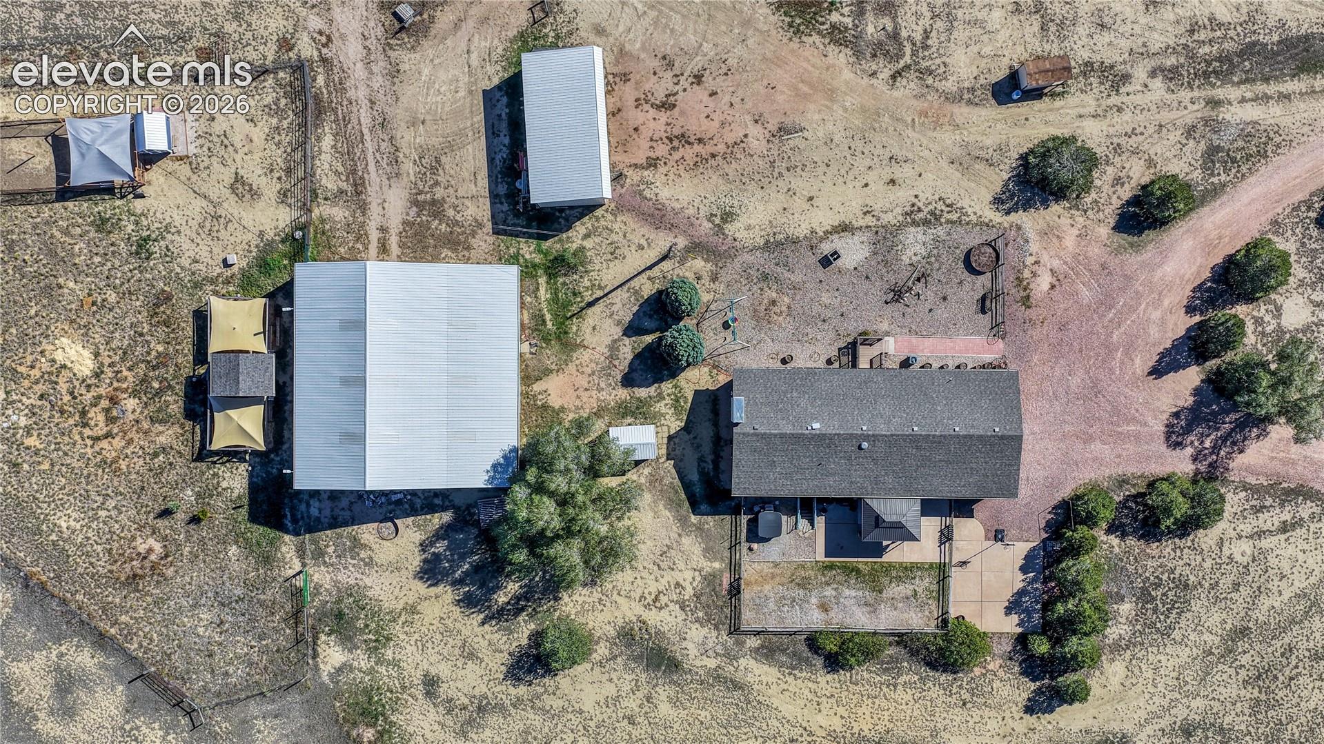 Overhead view of the home, barn and stable