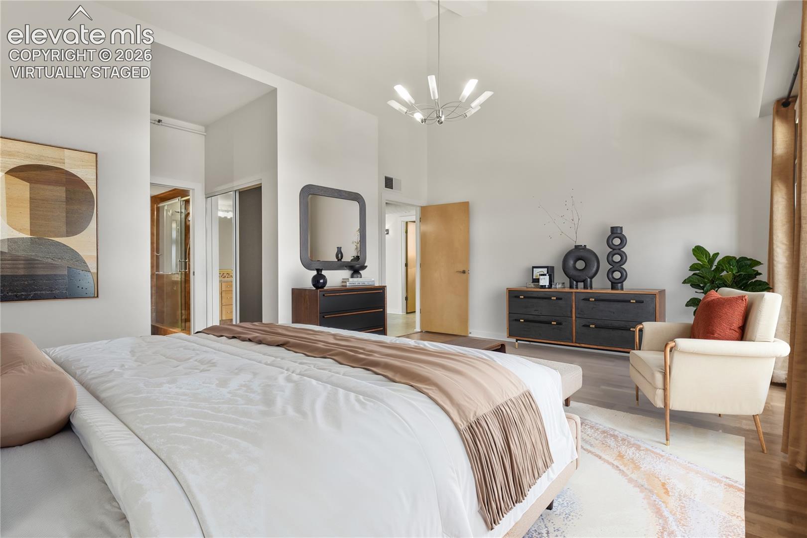 Main level primary bedroom with dual walk-in closets and en-suite bath. Virtually Staged