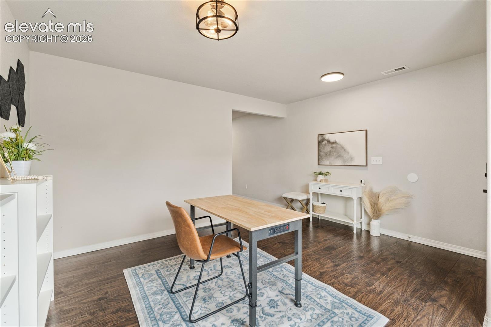 Wood-finish flooring, recessed lighting, and a semi-flush mount ceiling fixture