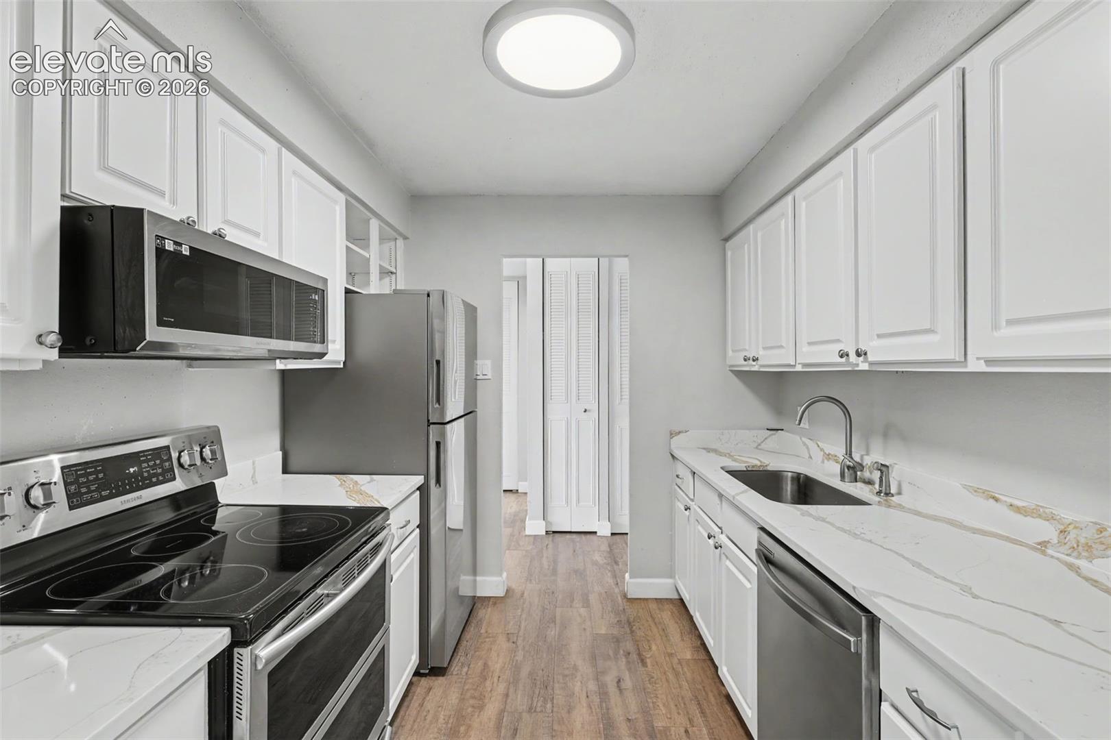 The Kitchen features gorgeous countertops and comes equipped with a Refrigerator, Range, Dishwasher, and Microwave!