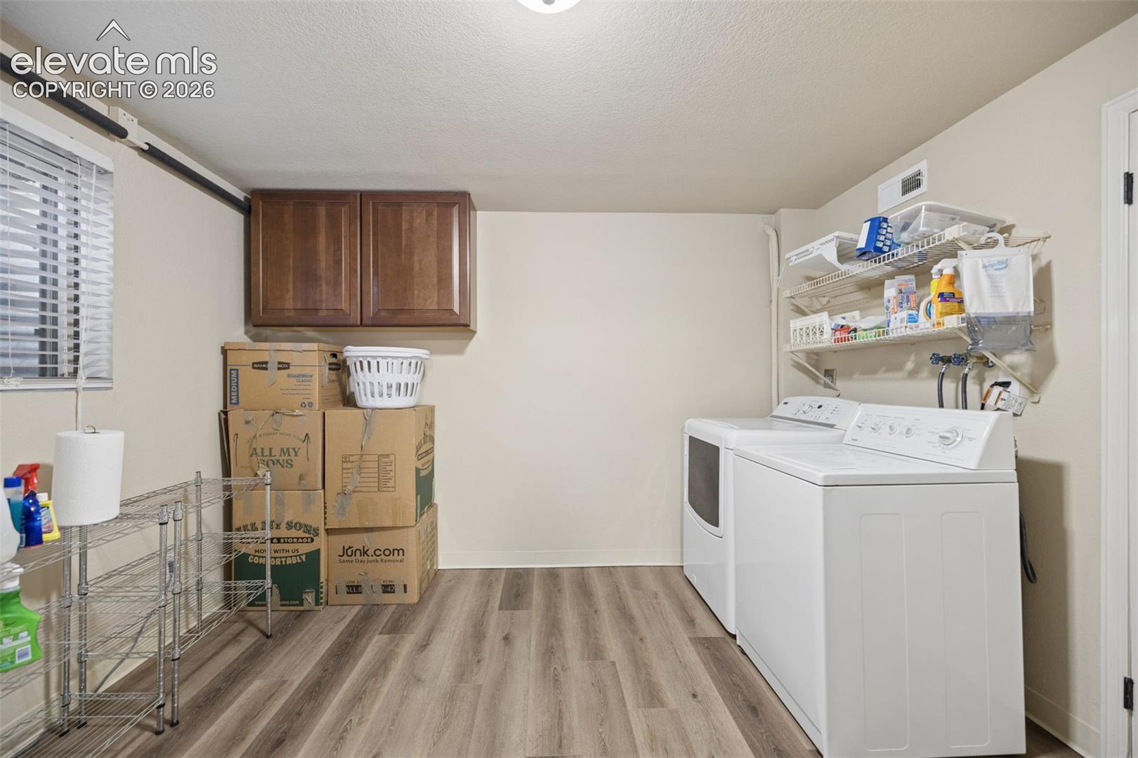 Generous basement laundry area and utility space attached to additional storage area
