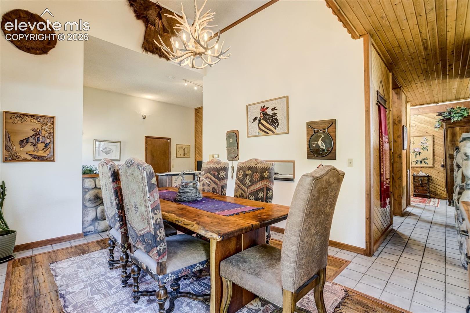 Dining room as accented laminate flooring within the surrounding carpet