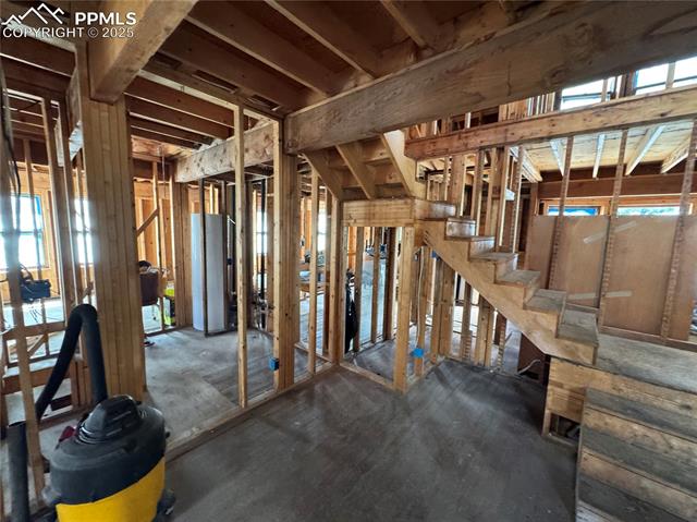 Misc room with healthy amount of natural light and water heater
