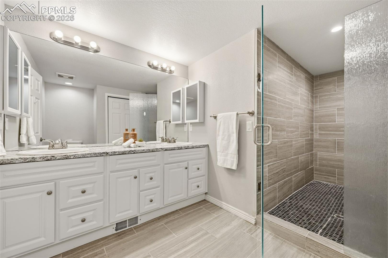 Bathroom attached to bed 5 has double sinks and huge walk in shower