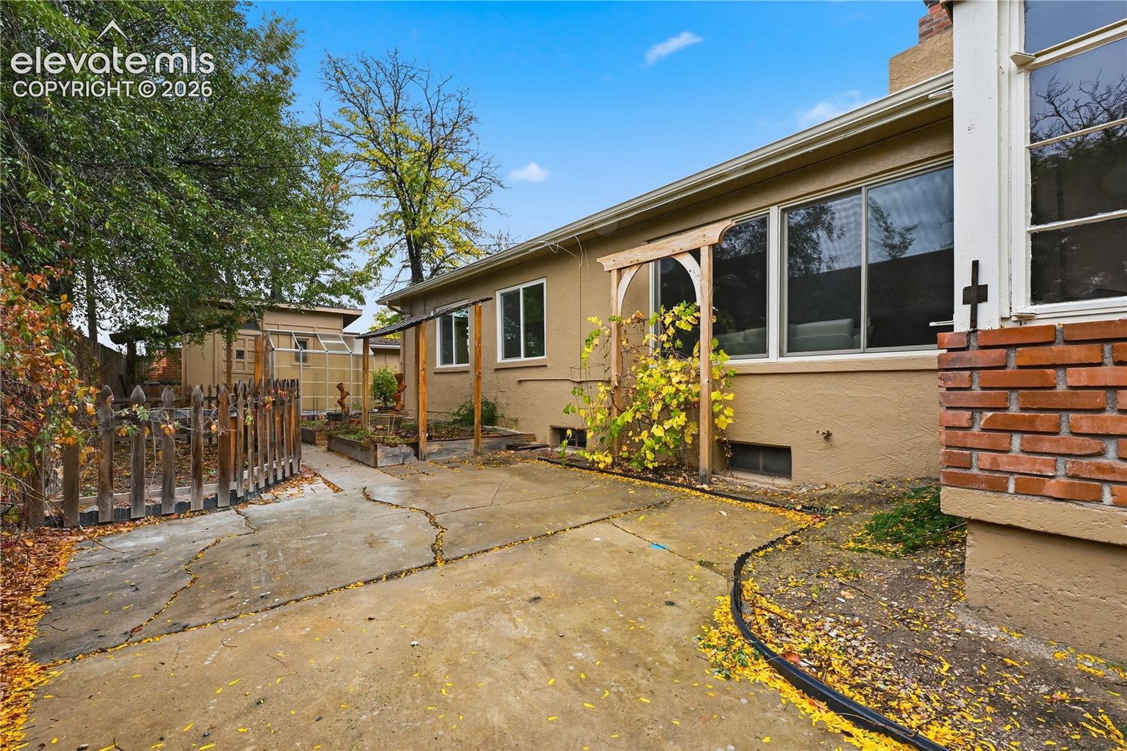 The back of the home. The living room windows are the expansive ones that allow lots of light.