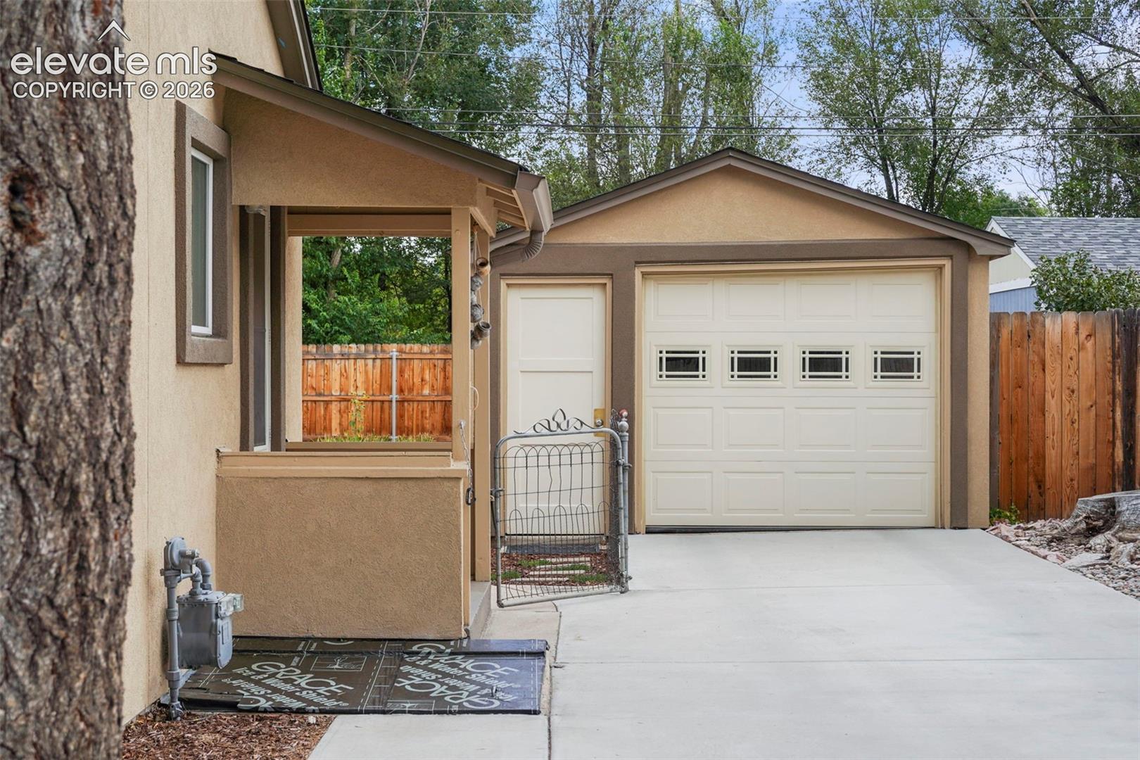 Garage with long driveway offers plenty of parking