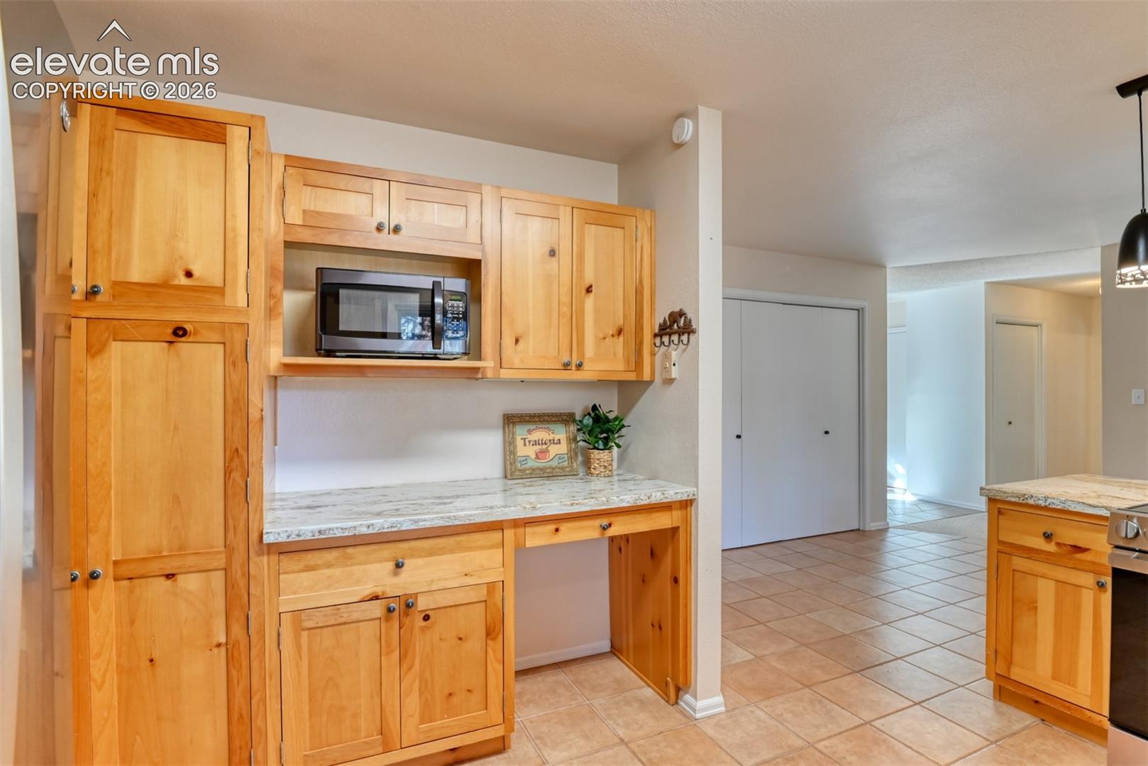 The kitchen has plenty of counter space even providing room for a coffee bar and large pantry. 