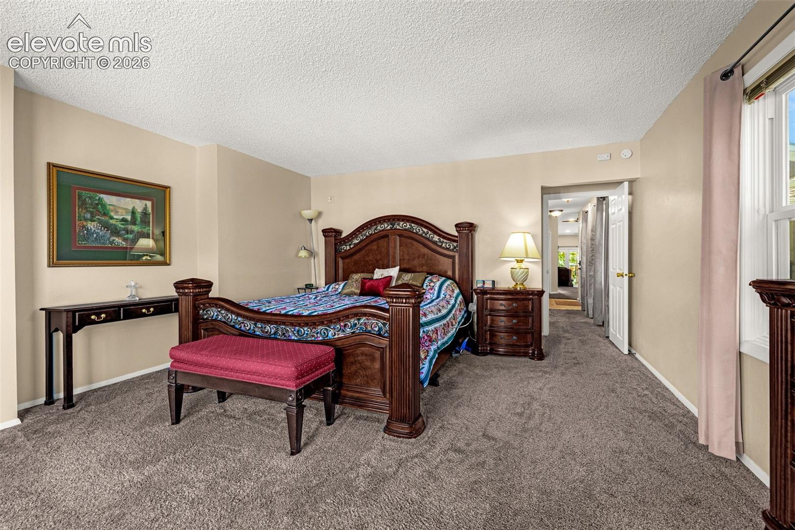 Primary bedroom with attached ensuite full bathroom