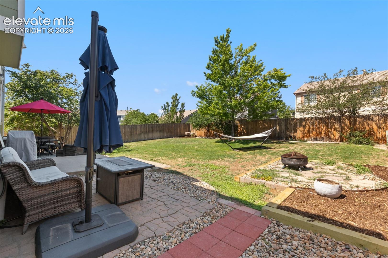 Backyard, patio and mature trees.