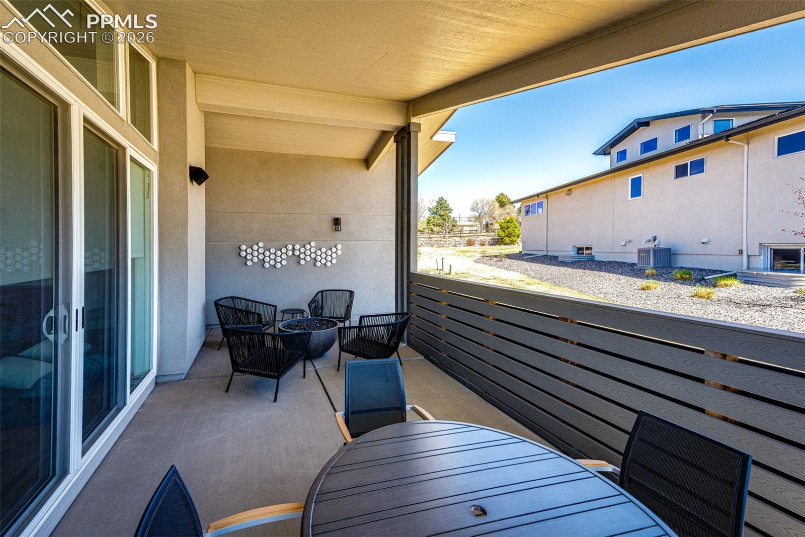 Covered patio with wind break wall