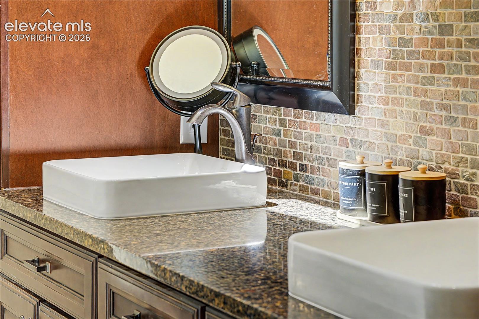 A closer look at the bathroom's mosaic tile backsplash and vessel sink reveals the level of detail throughout this home's updates.