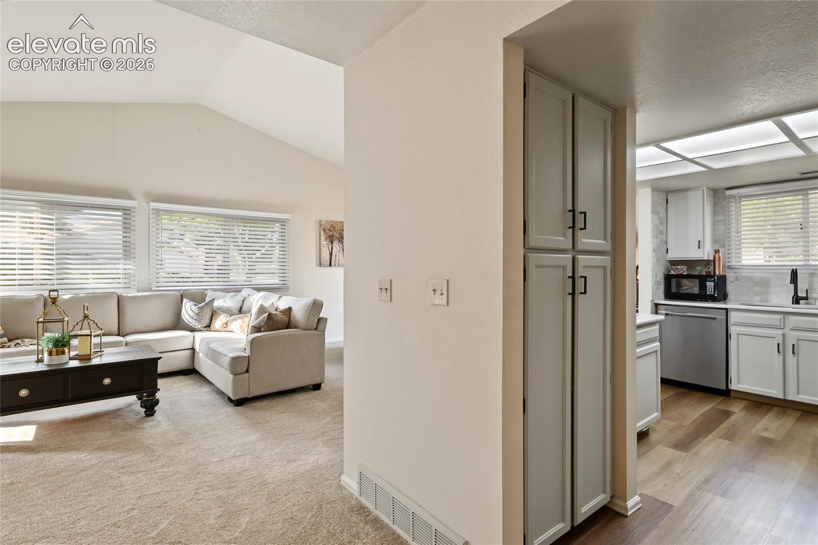 Vaulted ceiling with multiple windows