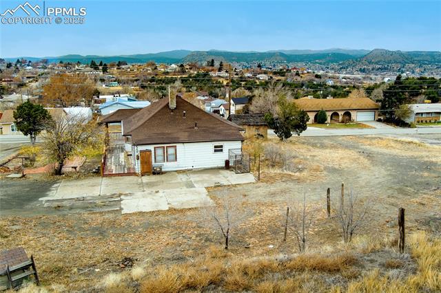 Aerial perspective of suburban area featuring a mountainous background