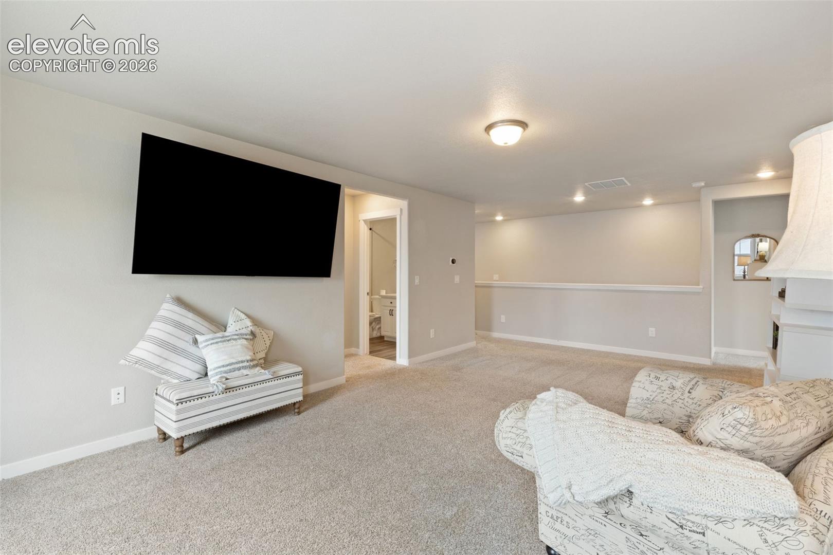 Spacious area useful for a media space, play room & more. Large closet in this area adds additional storage.
