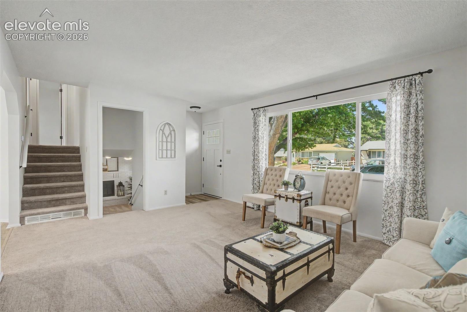 Large living room with new carpet and paint throughout