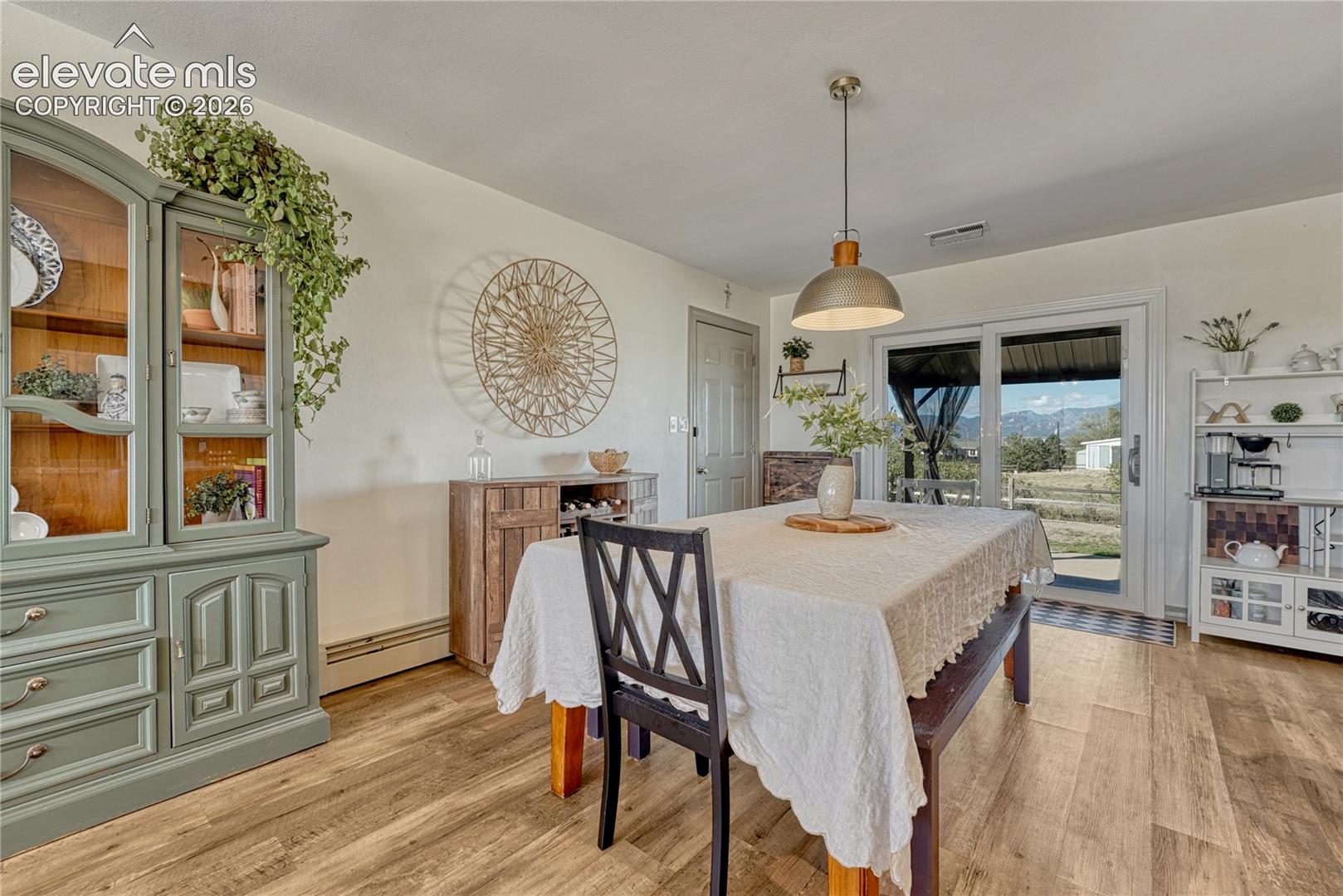 Dining area with sliding glass door to the covered patio