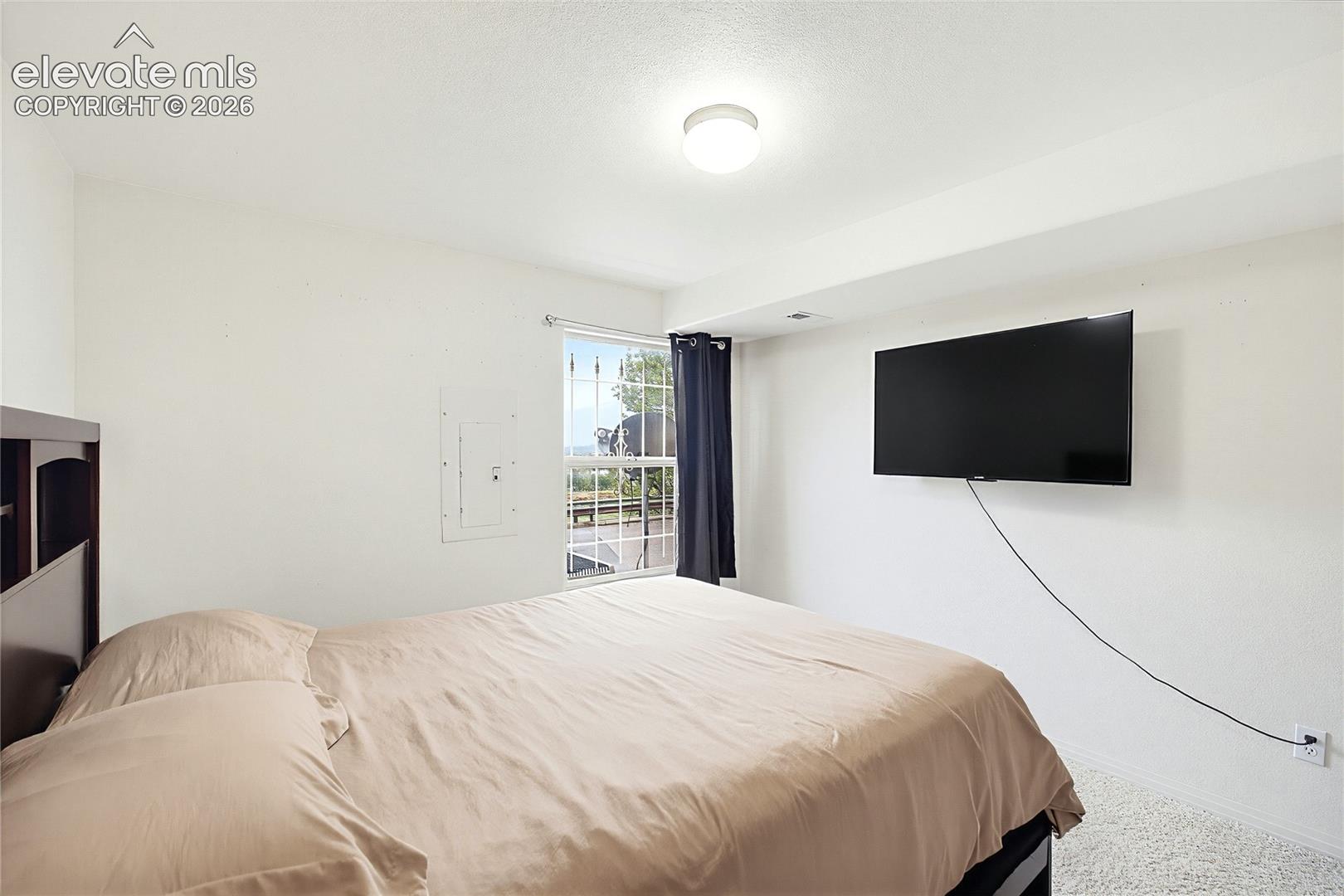 White walls and textured carpeting underfoot