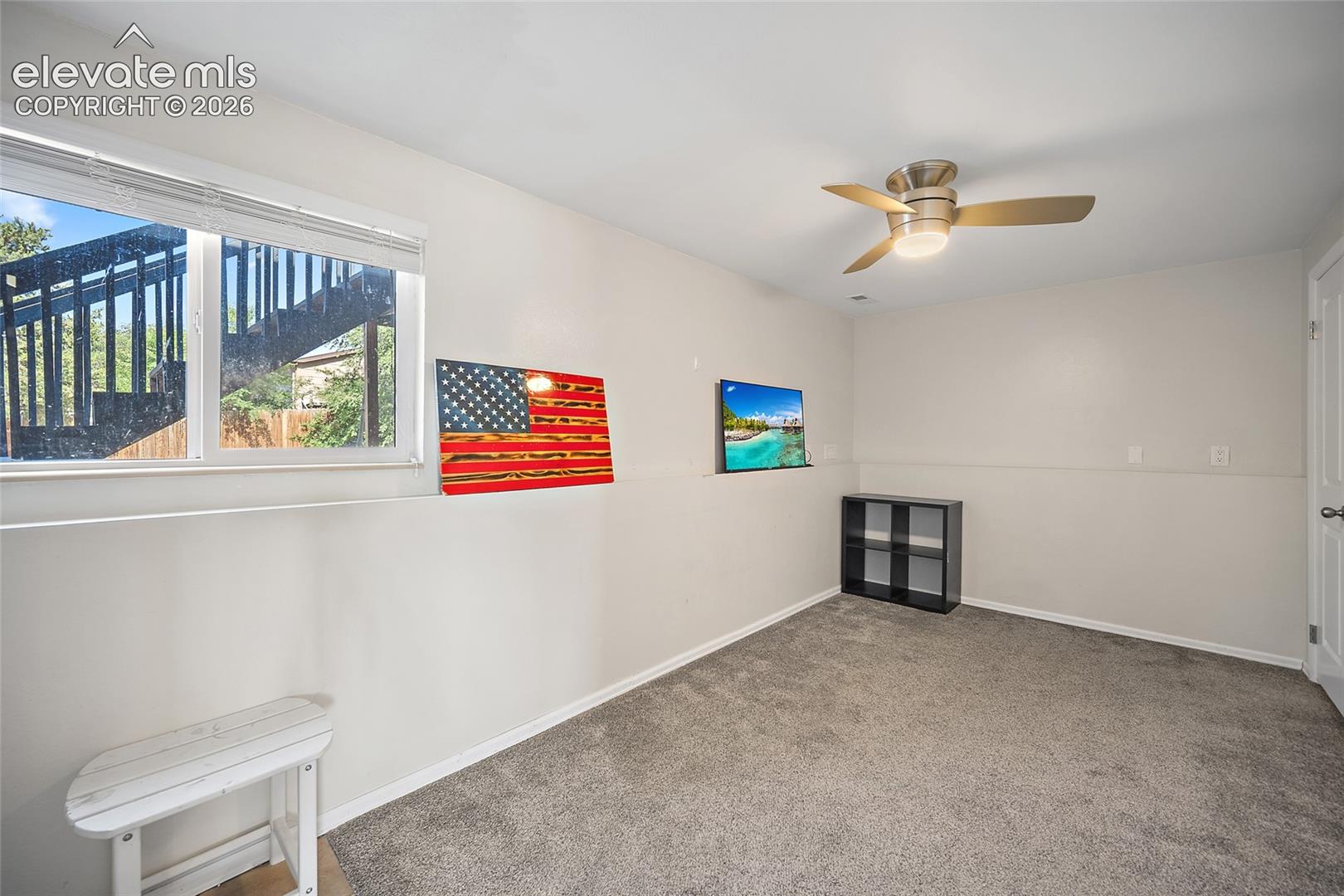 Family room with large window and natural light.