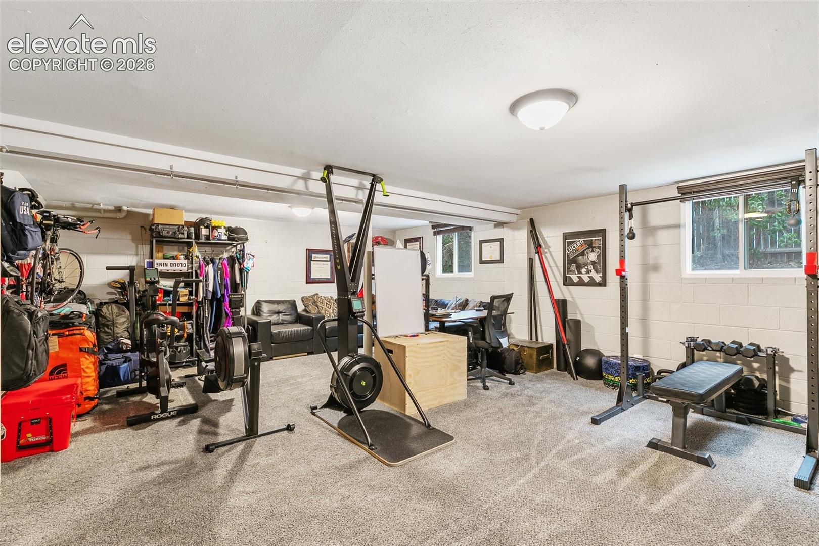 Large basement family room, currently used as an office and home gym